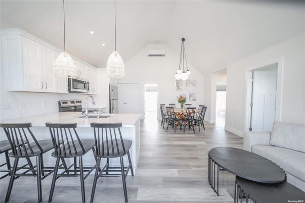 Dining room, Interior, Kitchen, Pendant Lights, Recessed Lighting, Stainless Steel Appliances, Wood Texture Flooring