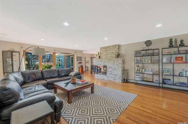 Fireplace, Interior, Living room, Recessed Lighting, Stone Walls, Wood Texture Flooring