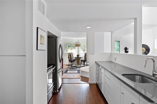 Dining room, Interior, Kitchen, Pendant Lights, Recessed Lighting, Stainless Steel Appliances, Wood Texture Flooring