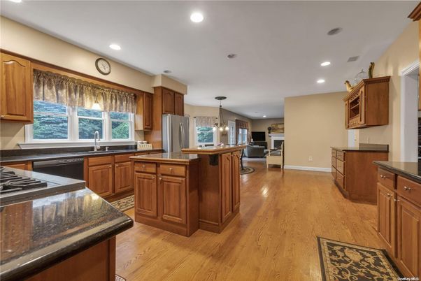 Chandelier, Fireplace, Interior, Kitchen, Pendant Lights, Recessed Lighting, Wood Texture Flooring
