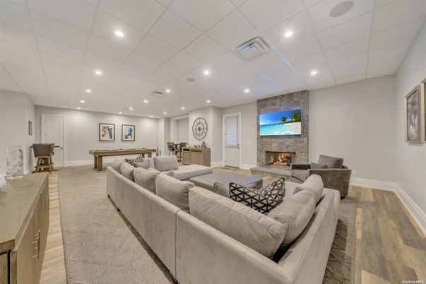 Billiard Table, Fireplace, Game Room, Interior, Living room, Recessed Lighting, Stone Walls, Wood Texture Flooring