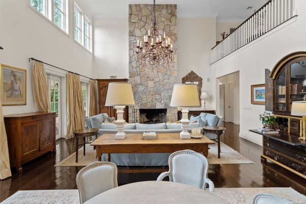 Chandelier, Fireplace, Interior, Living room, Pendant Lights, Stone Walls, Wood Texture Flooring