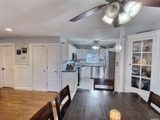 Dining room, Interior, Kitchen, Recessed Lighting, Stainless Steel Appliances, Wood Texture Flooring