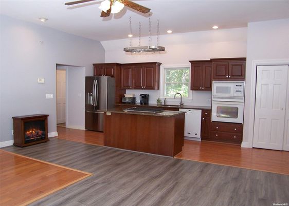 Fireplace, Interior, Kitchen, Pendant Lights, Recessed Lighting, Stainless Steel Appliances, Wood Texture Flooring