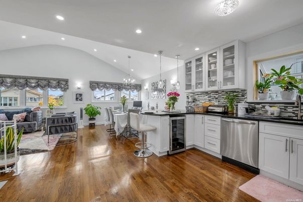 Chandelier, Dining room, Interior, Kitchen, Living room, Pendant Lights, Recessed Lighting, Stainless Steel Appliances, Wood Texture Flooring