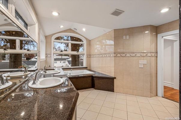 Bathroom, Dual Sink Vanities, Interior, Recessed Lighting, Wood Texture Flooring