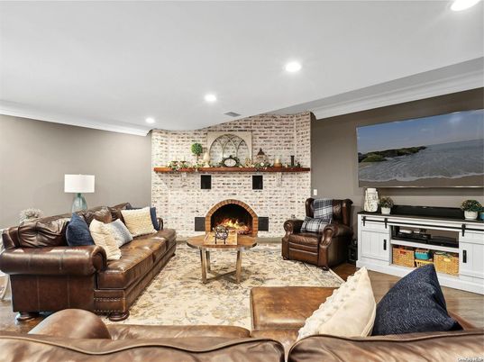 Fireplace, Interior, Living room, Recessed Lighting, Stone Walls, Wood Texture Flooring