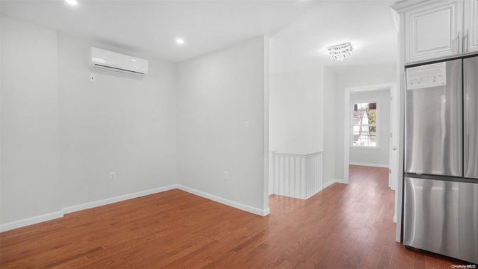 Empty room, Interior, Kitchen, Recessed Lighting, Stainless Steel Appliances, Wood Texture Flooring