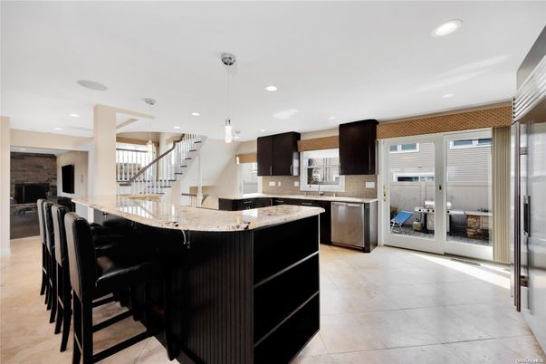 Fireplace, Interior, Kitchen, Pendant Lights, Recessed Lighting, Stainless Steel Appliances, Stone Walls
