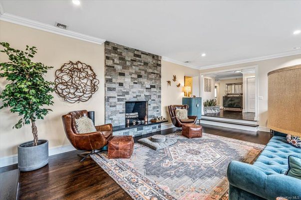 Fireplace, Interior, Living room, Recessed Lighting, Stone Walls, Wood Texture Flooring