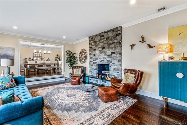 Fireplace, Interior, Living room, Pendant Lights, Recessed Lighting, Stone Walls, Wood Texture Flooring