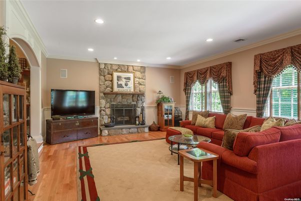 Fireplace, Interior, Living room, Recessed Lighting, Stone Walls, Wood Texture Flooring