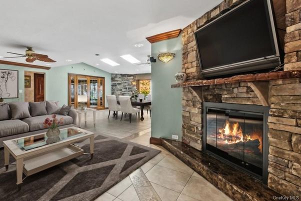 Dining room, Fireplace, Interior, Living room, Recessed Lighting, Stone Walls