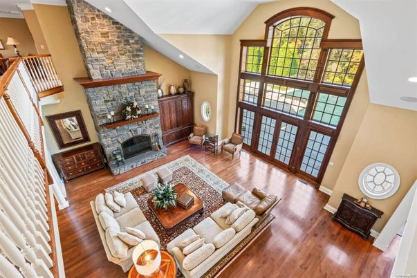 Fireplace, Interior, Living room, Recessed Lighting, Stone Walls, Wood Texture Flooring