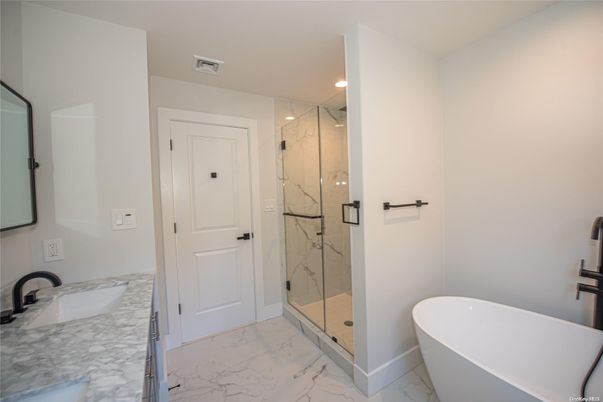 Bathroom, Free Standing Baths, Glass Shower, Interior, Marble, Marble Walls, Recessed Lighting