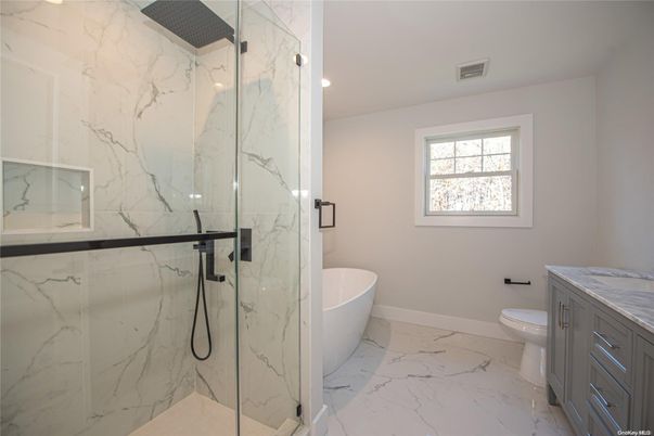 Bathroom, Free Standing Baths, Glass Shower, Interior, Marble, Marble Walls, Recessed Lighting