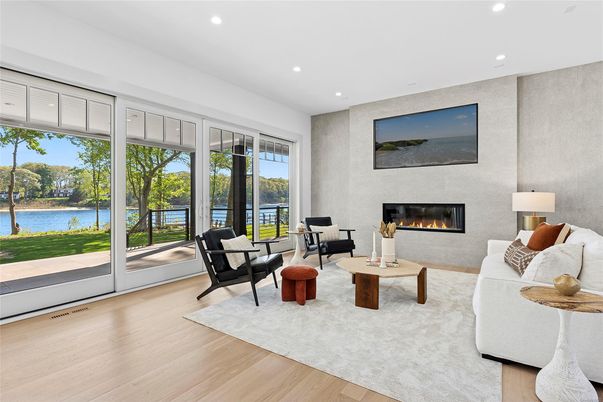 Fireplace, Interior, Living room, Recessed Lighting, Water, Wood Texture Flooring