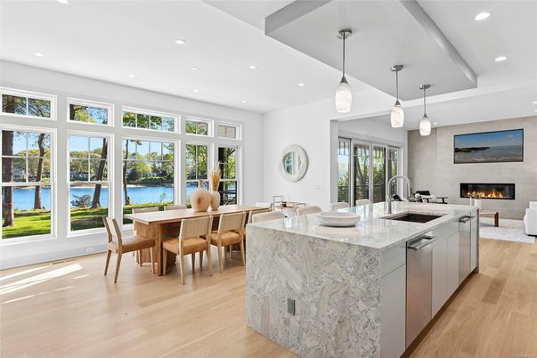Dining room, Fireplace, Interior, Kitchen, Living room, Pendant Lights, Recessed Lighting, Water, Wood Texture Flooring