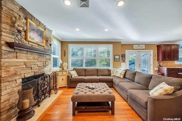 Fireplace, Interior, Living room, Recessed Lighting, Stone Walls, Wood Texture Flooring