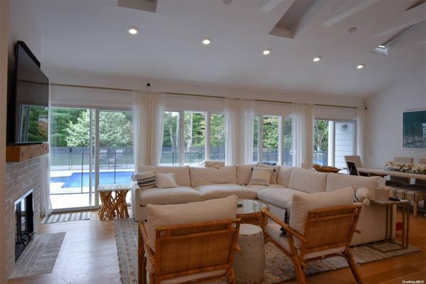 Dining room, Fireplace, Interior, Living room, Recessed Lighting, Wood Texture Flooring