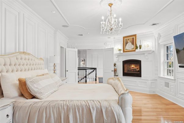 Bedroom, Chandelier, Fireplace, Interior, Recessed Lighting, Wood Texture Flooring