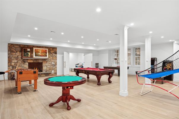 Billiard Table, Fireplace, Game Room, Interior, Recessed Lighting, Stone Walls, Wood Texture Flooring