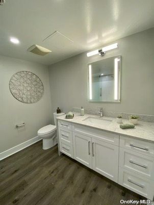 Bathroom, Dual Sink Vanities, Interior, Recessed Lighting, Wood Texture Flooring