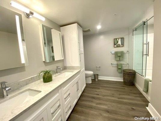 Bathroom, Dual Sink Vanities, Glass Shower, Interior, Recessed Lighting, Wood Texture Flooring