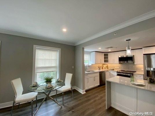 Dining room, Interior, Kitchen, Pendant Lights, Recessed Lighting, Stainless Steel Appliances, Wood Texture Flooring