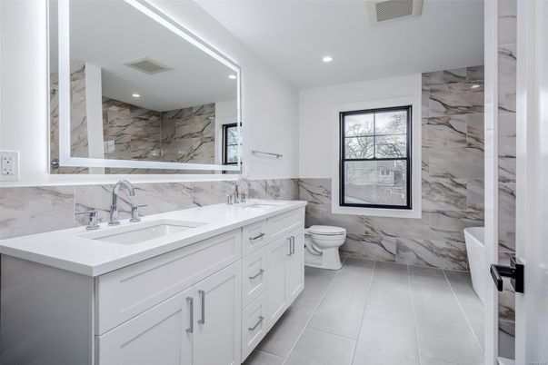 Bathroom, Dual Sink Vanities, Interior, Marble Walls, Recessed Lighting