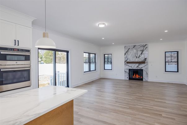 Fireplace, Interior, Kitchen, Pendant Lights, Recessed Lighting, Stainless Steel Appliances, Wood Texture Flooring