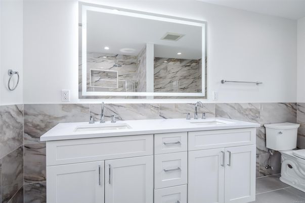Bathroom, Dual Sink Vanities, Interior, Marble Walls, Recessed Lighting