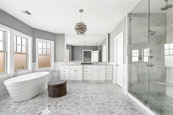 Bathroom, Chandelier, Dual Sink Vanities, Free Standing Baths, Glass Shower, Interior, Marble Walls, Pendant Lights
