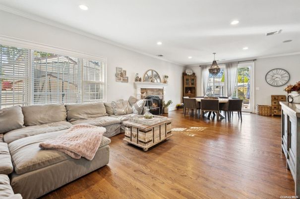 Dining room, Fireplace, Interior, Living room, Pendant Lights, Recessed Lighting, Wood Texture Flooring