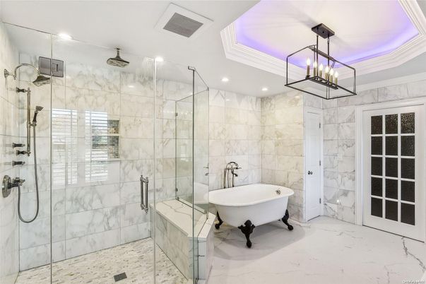 Bathroom, Chandelier, Free Standing Baths, Glass Shower, Interior, Marble, Marble Walls, Recessed Lighting