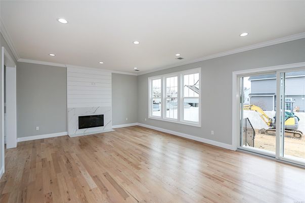 Empty room, Fireplace, Fitness Equipment, Interior, Recessed Lighting, Wood Texture Flooring
