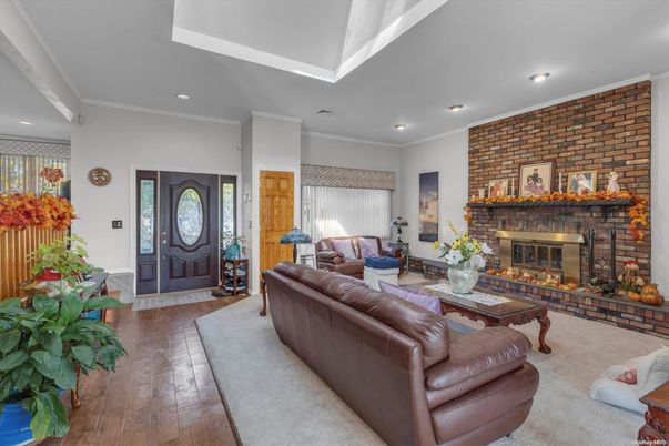 Fireplace, Interior, Living room, Recessed Lighting, Stone Walls, Wood Texture Flooring