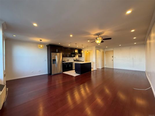 Chandelier, Empty room, Interior, Kitchen, Pendant Lights, Recessed Lighting, Stainless Steel Appliances, Wood Texture Flooring