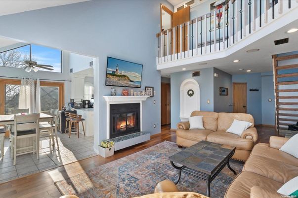 Dining room, Fireplace, Interior, Living room, Recessed Lighting, Wood Texture Flooring