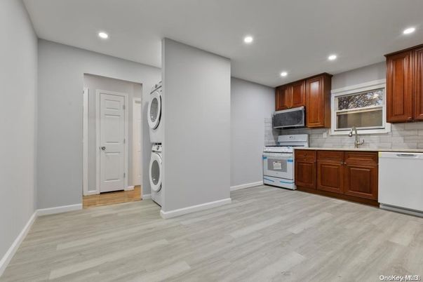 Interior, Kitchen, Recessed Lighting, Washer, Wood Texture Flooring