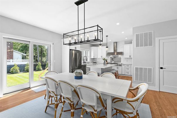 Dining room, Interior, Kitchen, Pendant Lights, Recessed Lighting, Stainless Steel Appliances, Wood Texture Flooring