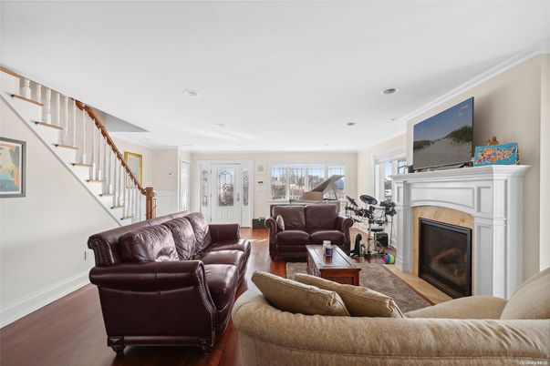 Fireplace, Interior, Living room, Piano, Recessed Lighting, Wood Texture Flooring
