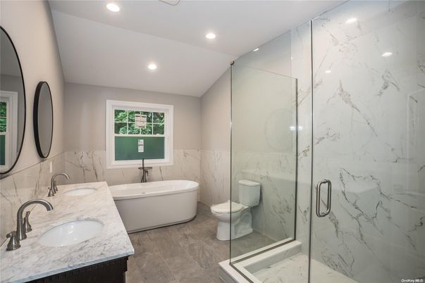 Bathroom, Dual Sink Vanities, Free Standing Baths, Glass Shower, Interior, Marble, Marble Walls, Recessed Lighting