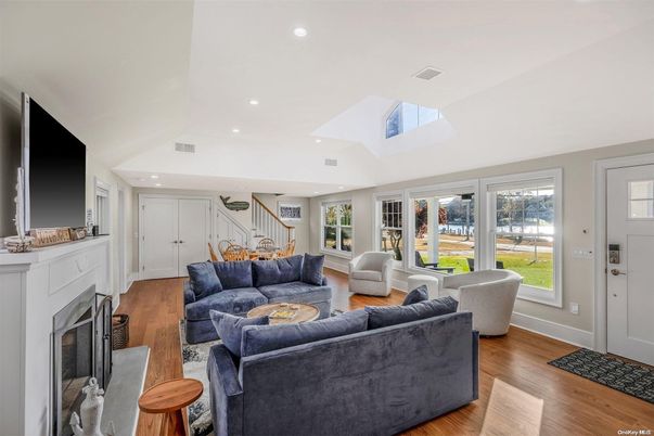 Fireplace, Interior, Living room, Recessed Lighting, Water, Wood Texture Flooring