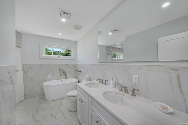 Bathroom, Dual Sink Vanities, Free Standing Baths, Interior, Marble, Marble Walls, Recessed Lighting