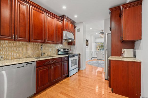 Chandelier, Dining room, Interior, Kitchen, Pendant Lights, Recessed Lighting, Stainless Steel Appliances, Wood Texture Flooring