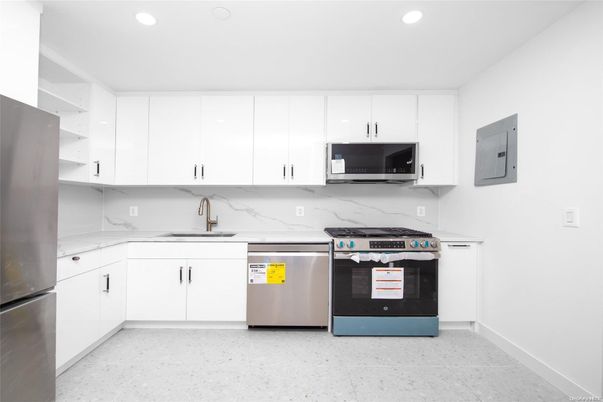 Interior, Kitchen, Marble Walls, Recessed Lighting, Stainless Steel Appliances