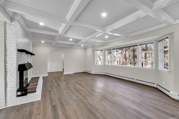 Empty room, Fireplace, Interior, Recessed Lighting, Stone Walls, Wood Texture Flooring