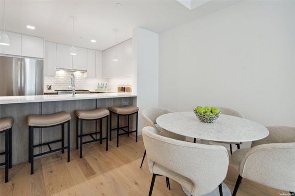 Dining room, Interior, Kitchen, Pendant Lights, Recessed Lighting, Stainless Steel Appliances, Wood Texture Flooring