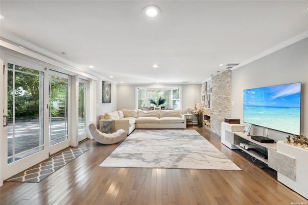 Fireplace, Interior, Living room, Recessed Lighting, Stone Walls, Wood Texture Flooring